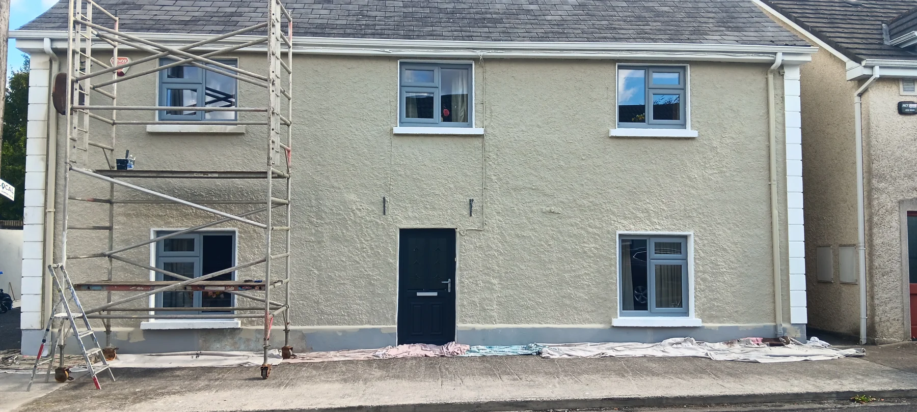 The same house during the work, with scaffolding